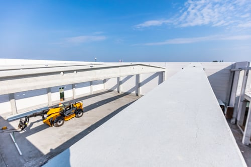 Commercial Flat Roof Coating vs Replacement Guide
